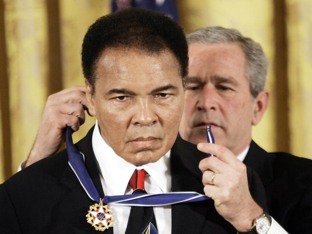 November 9, 2005: US President George W Bush presents Ali with the Presidential Medal of Freedom.