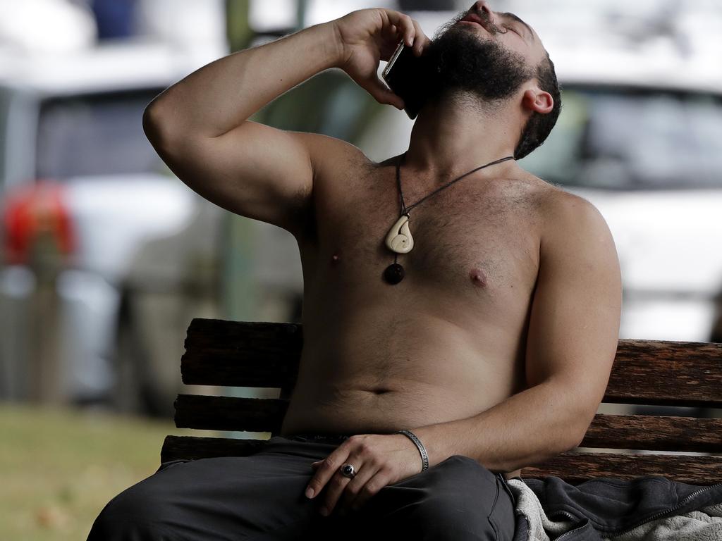 A man reacts as he speaks on a mobile phone outside a mosque in central Christchurch, New Zealand. Picture: AP