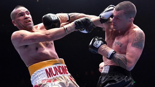 Anthony Mundine (left) and John Wayne Parr trade blows. Picture: AAP