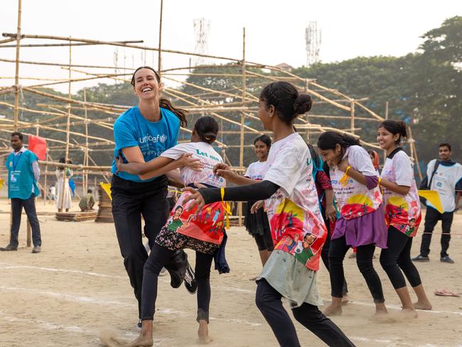 Playing Kabaddi, the national game of Bangladesh and traditionally a male sport. Olympian Emma McKeon, a UNICEF Australia ambassador, visits one of the slum areas in Bangladesh at Korial, in the capital Dhaka. Picture: Jason Edwards