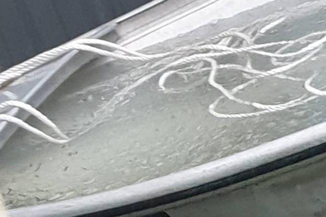 A flooded boat. Picture: Tracey Beer