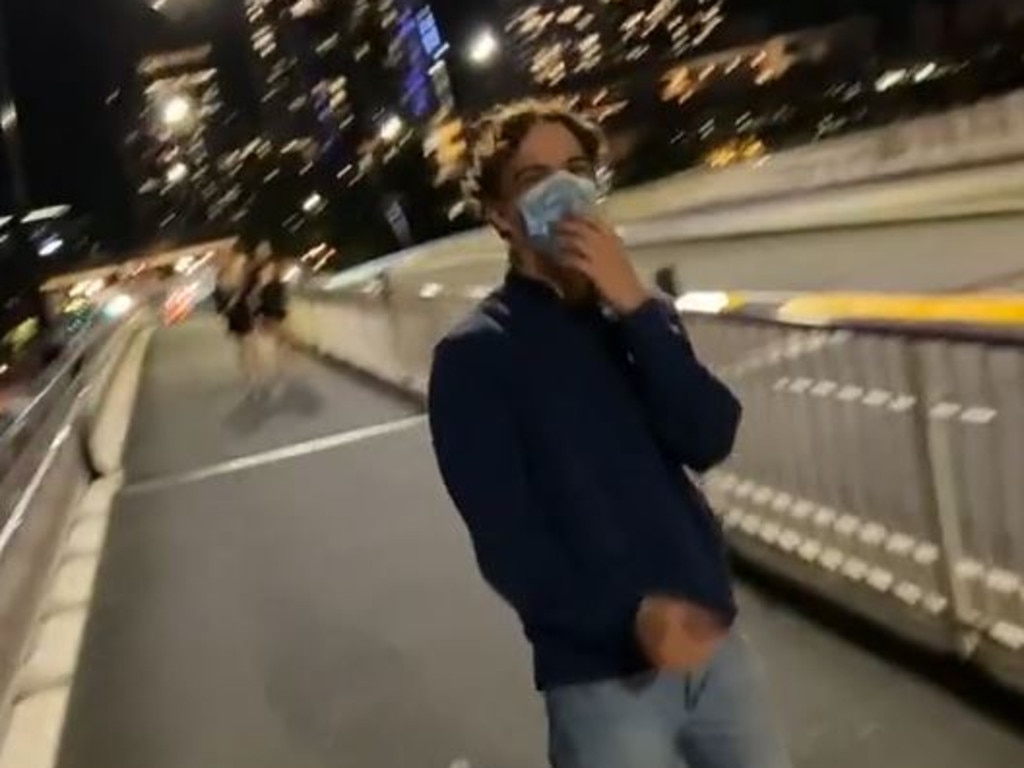 TikTok footage of a man throwing a scooter into the Brisbane River.