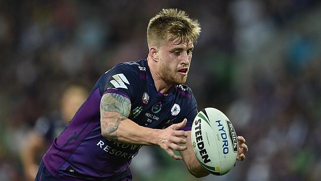 Cameron Munster of the Storm marks the ball.