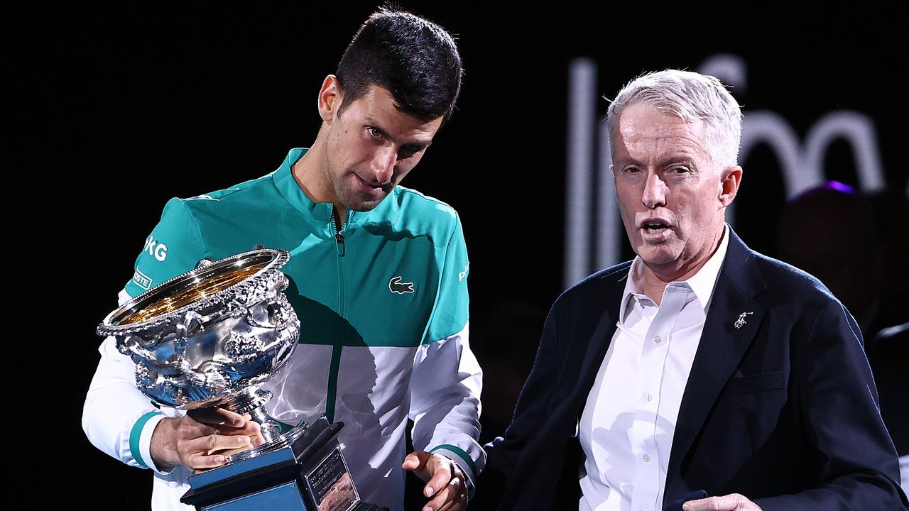 MELBOURNE, AUSTRALIA - FEBRUARY 21: Novak Djokovic of Serbia speaks with CEO of Tennis Australia Craig Tiley as he holds the Norman Brookes Challenge Cup following victory in his MenÃ¢â&#130;¬â&#132;¢s Singles Final match against Daniil Medvedev of Russia during day 14 of the 2021 Australian Open at Melbourne Park on February 21, 2021 in Melbourne, Australia. (Photo by Cameron Spencer/Getty Images)