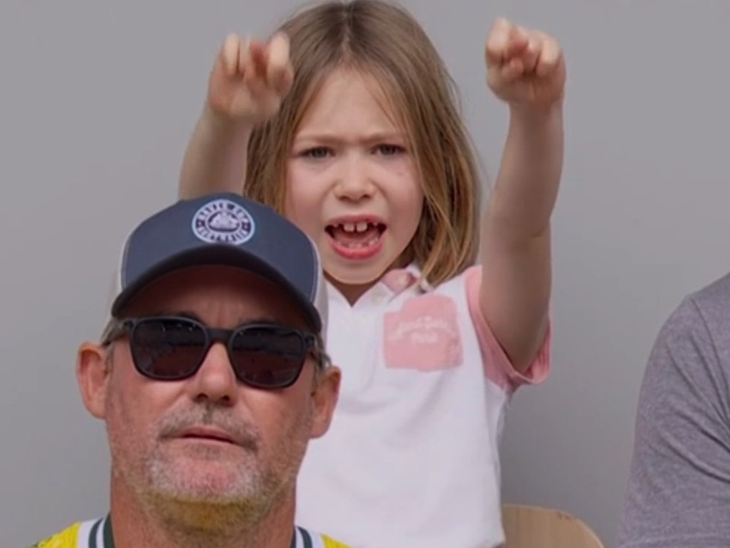 John Peers’ daughter Ellie crossers her fingers as she watches her dad win the gold medal in doubles with Matthew Ebden at Roland-Garros.