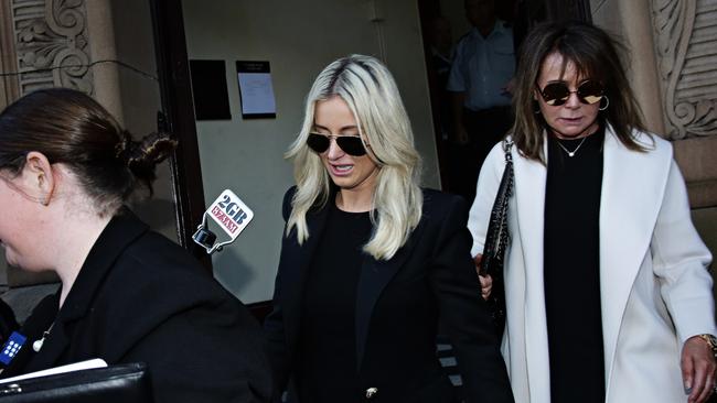 Curtis’ wife Roxy Jacenko tries to avoid the media as she leaves the courthouse this afternoon. Picture: Adam Yip / The Daily Telegraph