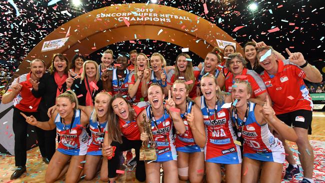 NSW Swifts players and staff celebrate after winning the 2019 Super Netball grand final against Sunshine Coast Lightning. Picture: AAP