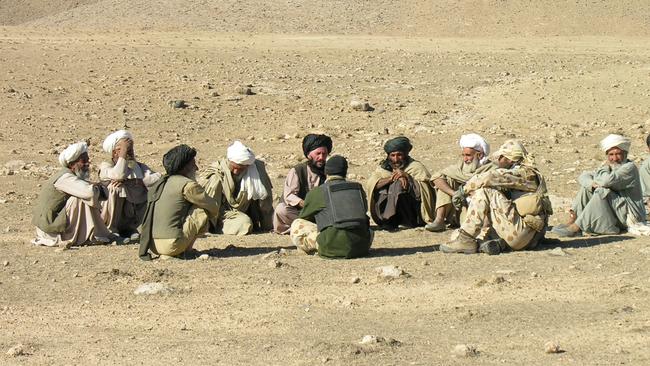 A troop commander uses an interpreter to help negotiate a ceasefire between rival factions during combat in Afghanistan. Picture: Supplied