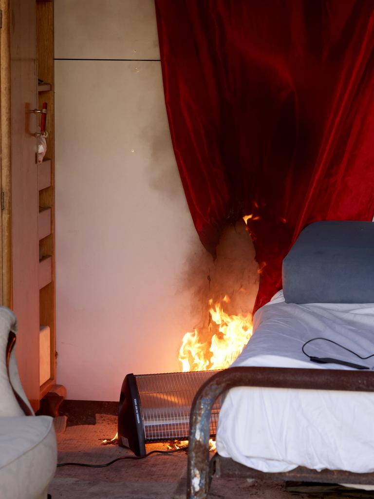 A heater sparks a fire in a demonstration room, quickly spreading to a curtain. Picture: Steve Pohlner