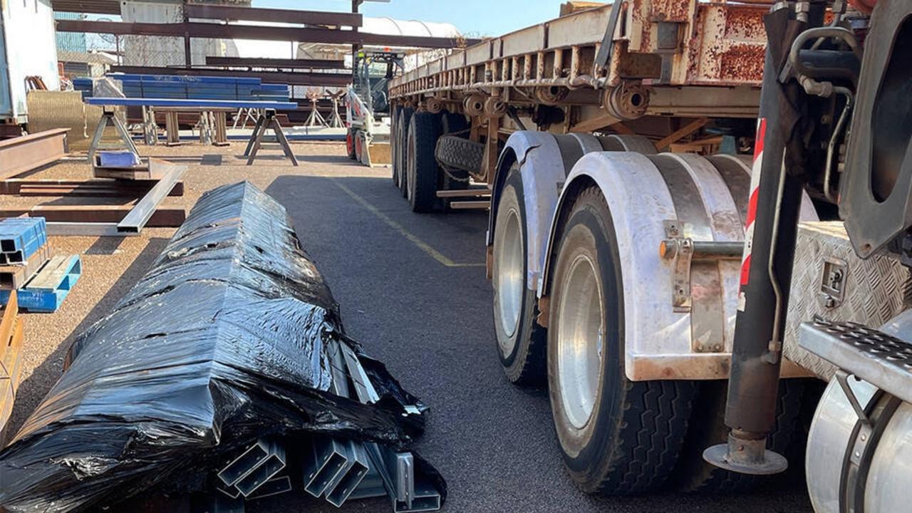 A Darwin subcontractor faces months of rehabilitation after being crushed by a 1.2 tonne bundle of steel beams (pictured) while standing beside a trailer in late September 2023. Picture: NT WorkSafe