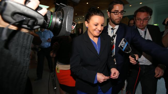 Palmer United Party Senator Jacqui Lambie after an event is surrounded by media at Parliament House in Canberra
