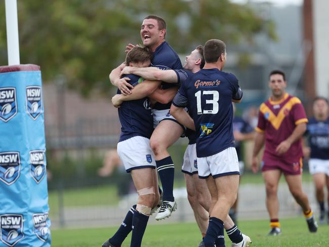 Newcastle’s Jayden Butterfield celebrates with Cameron Anderson after Cameron’s try. Picture: Sue Graham