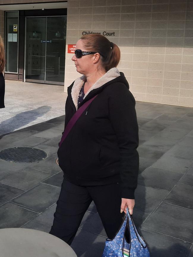 Rebecca Reid, 43, leaves the ACT Magistrates Court after being sentenced for using forged sick notes so she could spend the day in bed. Picture: Craig Dunlop