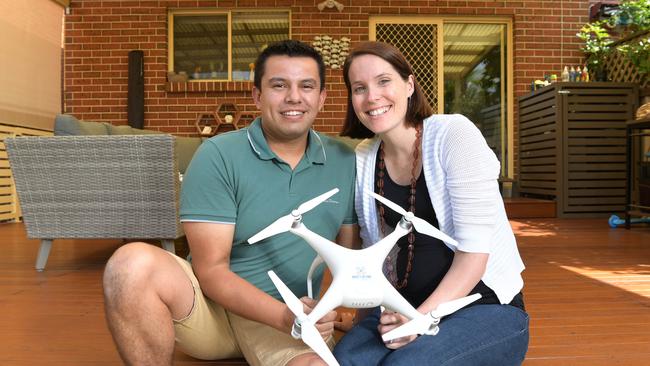 Gabriel and Catherine Mihalas with a drone Gabriel uses for a second income stream. Picture: Simon Bullard