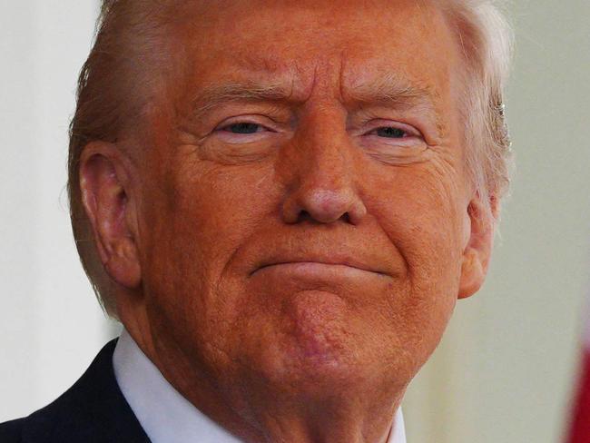 TOPSHOT - US President Donald Trump waits to greet British Prime Minister Keir Starmer at the entrance of the West Wing of the White House in Washington, DC, on February 27, 2025. Starmer is meeting Trump to plead for a US backstop to any Ukraine ceasefire, insisting it would be the only way to stop Russia's Vladimir Putin from invading again. Starmer arrived in Washington late Wednesday to build on a visit by French President Emmanuel Macron, amid growing concerns in Europe that the US leader is about to sell Kyiv short in negotiations with Putin. (Photo by Carl Court / POOL / AFP)