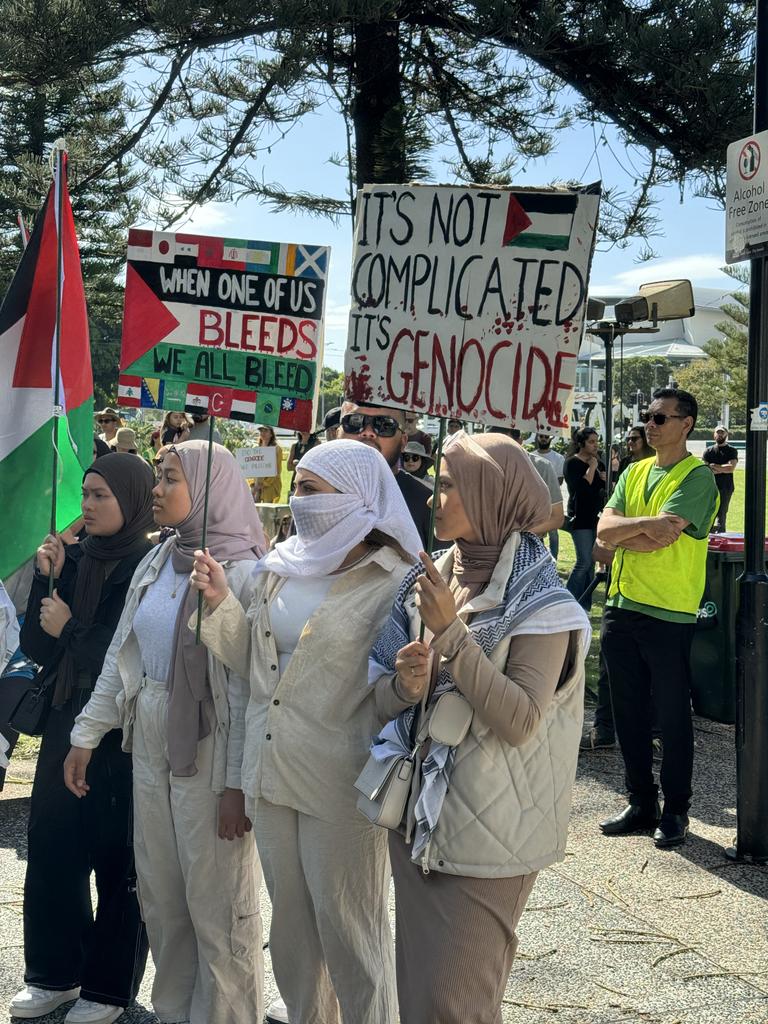 A protester holding a poster at a Palestine solidarity rally held at Victoria Park, Broadbeach on 18.11.23. Picture: Amaani Siddeek