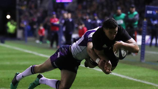 Codie Taylor of New Zealand scores the opening try at Murrayfield in Edinburgh.