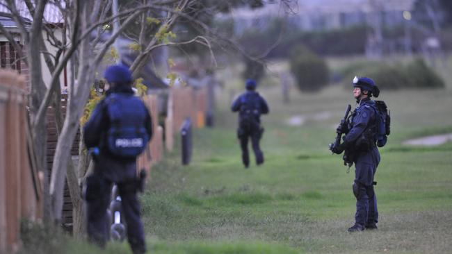 Special operations police on site at the siege in Cranbourne. Picture: Ian Currie