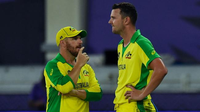 Aaron Finch, left, says Hazlewood forced his way into World Cup squad after a strong IPL series. Picture: AFP