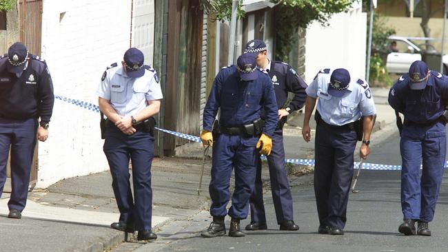 Police looking for evidence at the scene of the shooting of Michael Marshall in South Yarra.