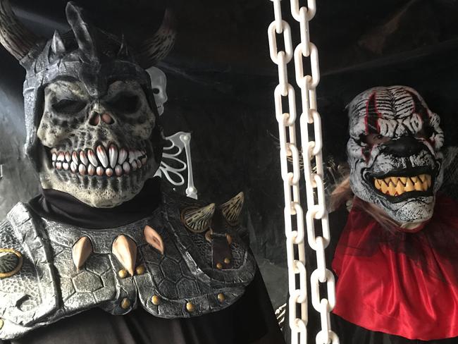 Shane Raics and daughter Jakaya in costume in their Halloween haunted house in Shortland Avenue at Killarney Vale. Picture: Cathy Stubbs.