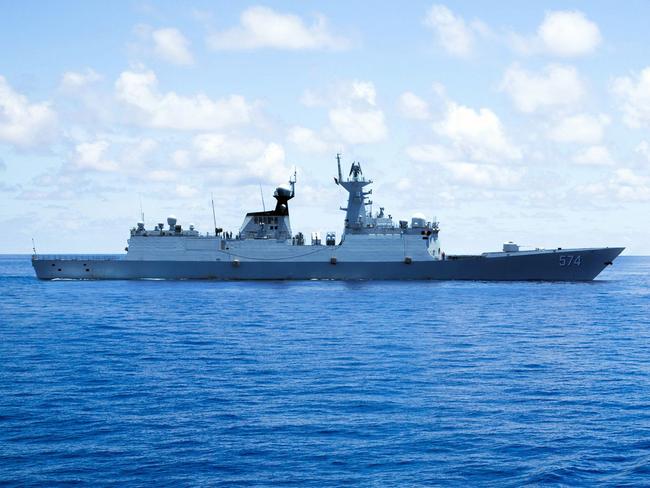 This photo taken on May 10, 2016 shows crew members of China's South Sea Fleet taking part in a logistics supply drill near the James Shoal area on South China Sea. Beijing claims sovereignty over almost the whole of the South China Sea, on the basis of a segmented line that first appeared on Chinese maps in the 1940s, pitting it against several neighbours. / AFP PHOTO / STR / China OUT / TO GO WITH AFP STORY CHINA-POLITICS-MARITIME-DIPLOMACY BY BEN DOOLEY