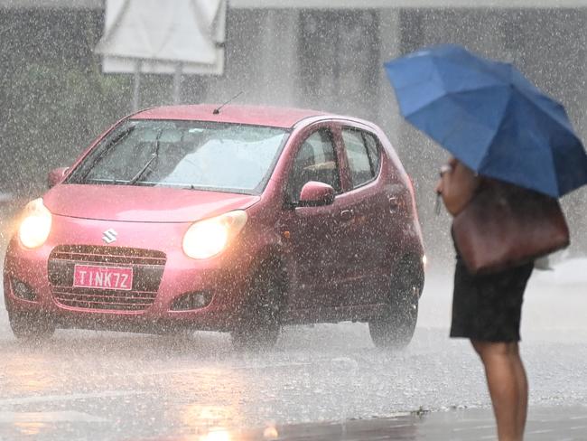 BRISBANE, AUSTRALIA - NewsWire Photos - FEBRUARY 2, 2021.People make their way through heavy rain in central Brisbane. A severe thunderstorm warning with possible flash flooding has been issued for the southeast, including Brisbane CBD, as wet weather causes traffic chaos on Tuesday morning.Picture: NCA NewsWire / Dan Peled