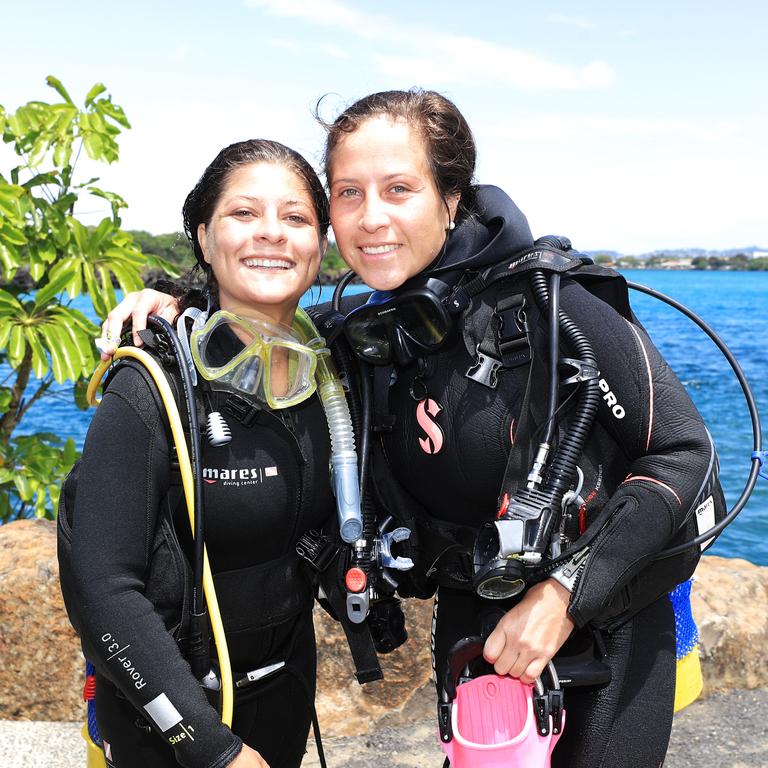 Scuba divers Margaret Hummel from the USA and Isabel Grisales (Columbia) return from a dive off the lower Gold Coast. Photo: Scott Powick Newscorp