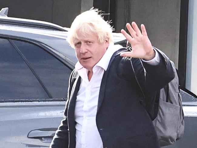 Former British Prime Minister Boris Johnson walks, at Gatwick Airport, near London, Britain October 22, 2022. REUTERS/Henry Nicholls