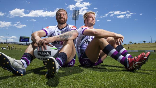 Storm duo Christian Welch and Jesse Bromwich relax at Sunshine Coast Stadium. Picture: Lachie Millard