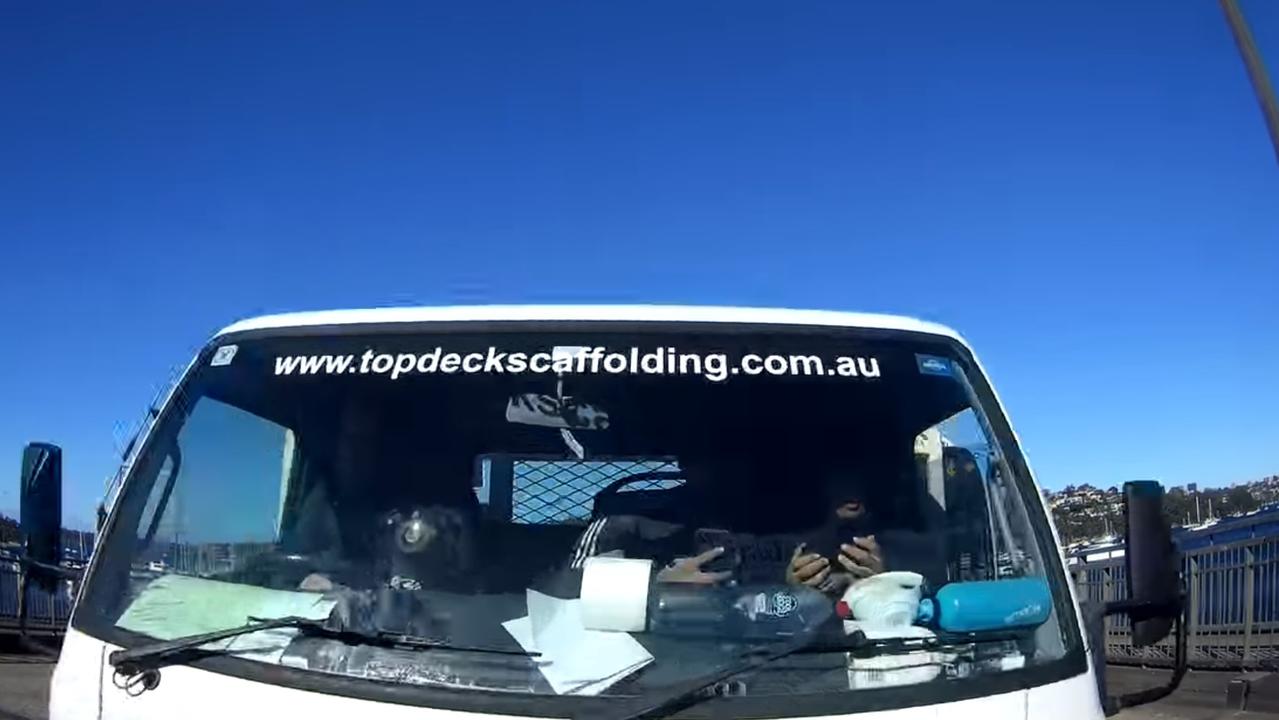 Two passengers were shown using their phone. Picture: Facebook/DashCamOwnersAustralia