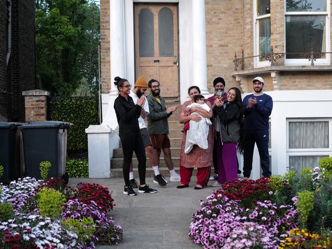 A London family show their support for medical workers. Picture: Getty Images