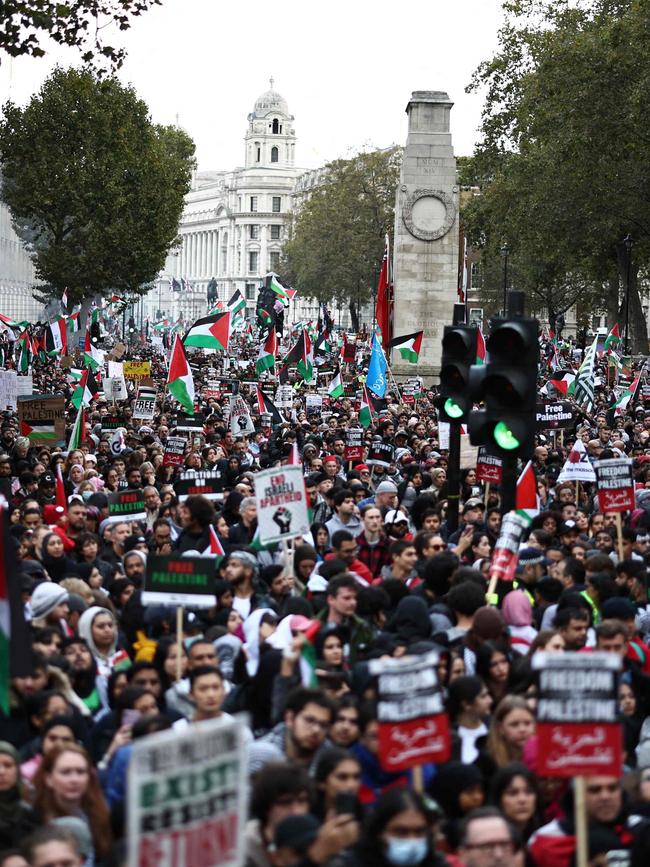 Marchers held signs reading “Freedom for Palestine” and “Stop Bombing Gaza”. Picture: Henry Nicholls/AFP