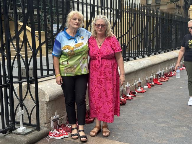 Simone Patterson OAM (left) leads 'red shoe' demonstrations honouring the lives of women and children killed by domestic violence. Picture: Supplied