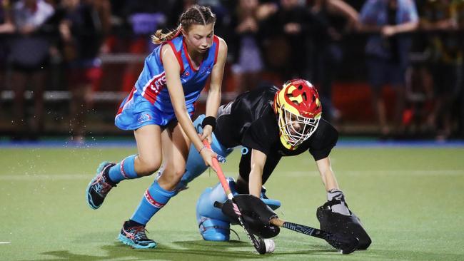 Saints' Bree Pendrigh and Brothers goal keeper Ella McLeod fight it out in the penalty shootout in the Cairns Hockey Association Under 18A Women's match between Brothers and Saints. PICTURE: BRENDAN RADKE