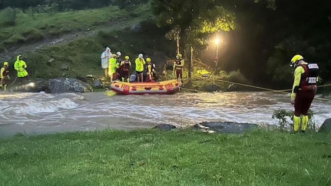 Firefighters rescue campers south of the Gold Coast after the area was inundated with huge rainfall. Picture: QFES