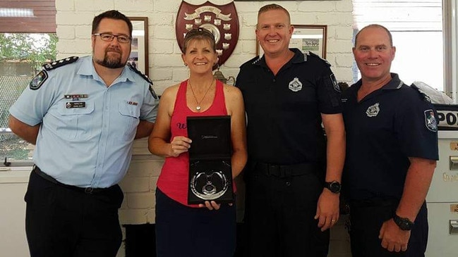 Julie Jennings, original owner of troop horse Manny, with Senior Sergeant Paul Mason (R) and Senior Constable David Masters (far right).