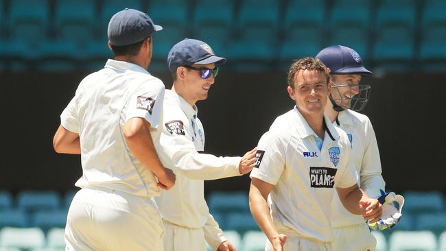 Steven O'Keefe of NSW celebrates the wicket of Marcus Stoinis of Victoria during the NSW v Victoria Sheffield Shield game at the SCG. Picture: Mark Evans