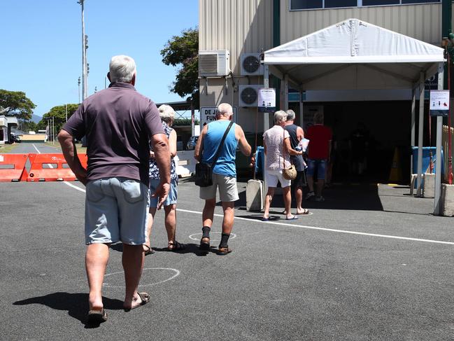 Pre polling ahead of the Queensland state government election on October 31 has begun, with polling booths in two locations in Cairns. Voters queue up 1.5 metres apart at the polling booth at the Cairns Showground. PICTURE: BRENDAN RADKE