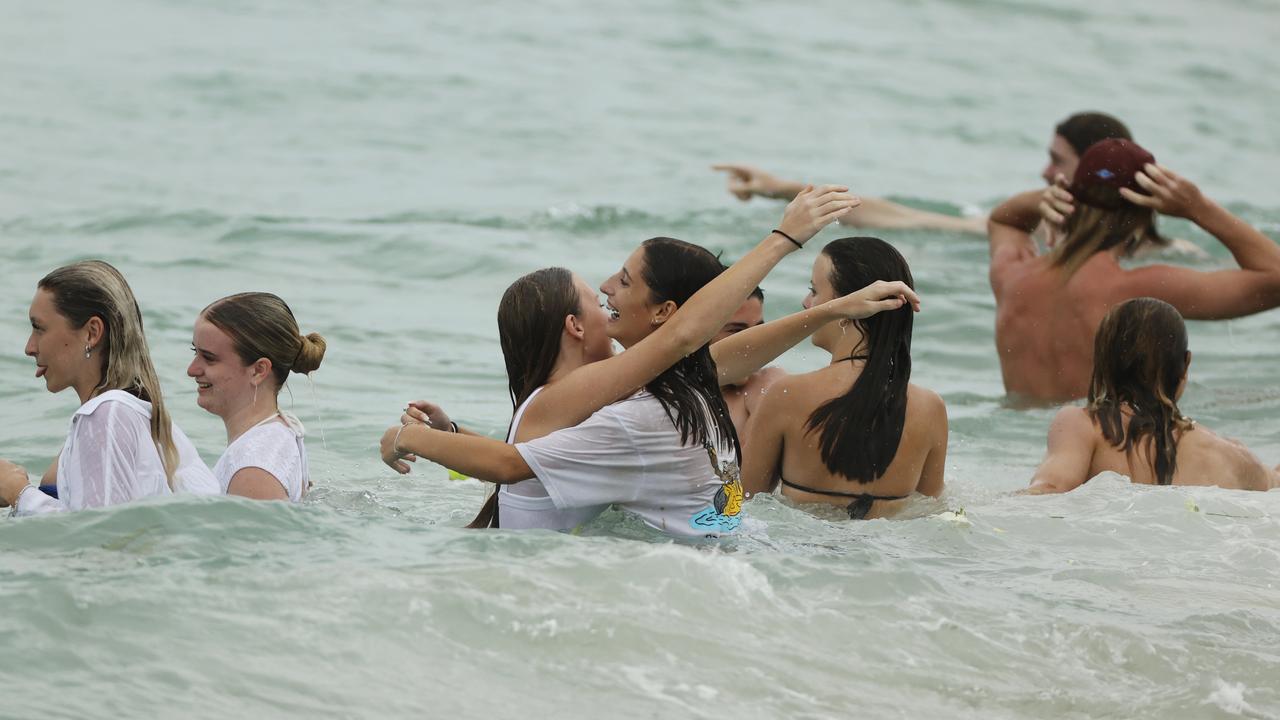 Some took to the water during an emotional afternoon at Buddina as friends paid tribute to Balin Stewart. Picture: Lachie Millard