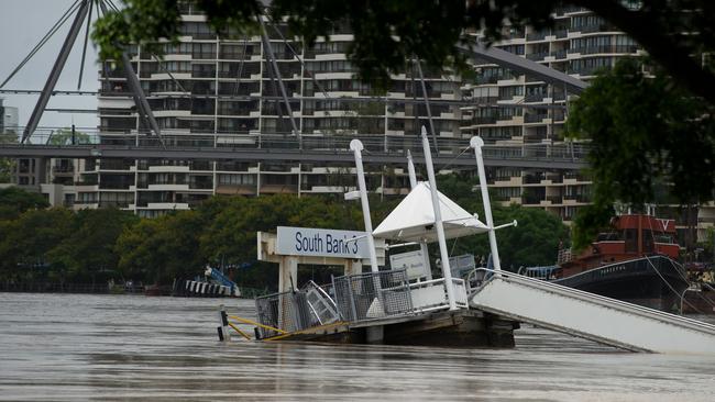 A ferry terminal struggles to stay connected on the Brisbane river at South Bank on Wednesday, January 12, 2011.