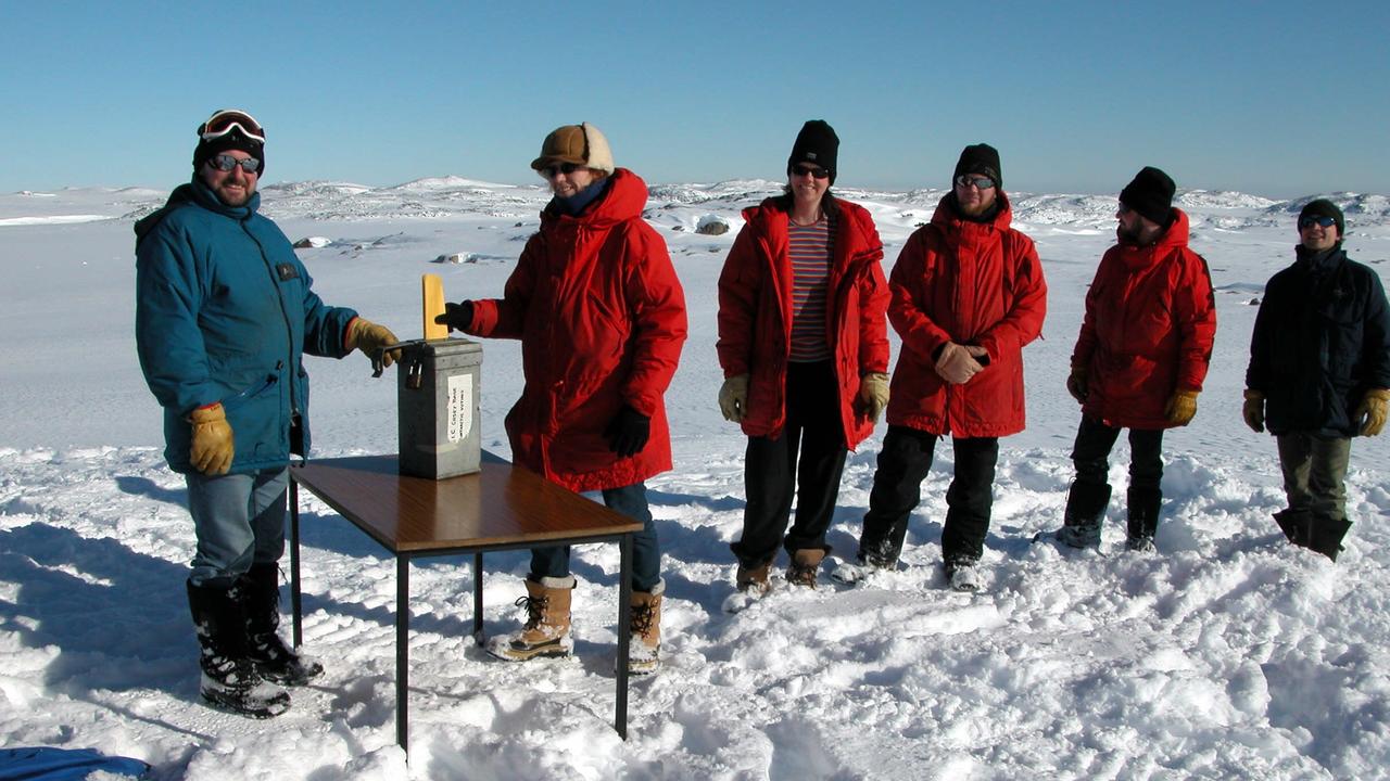 Scientists at Casey, an Australian research station in Antarctica, line up to vote.