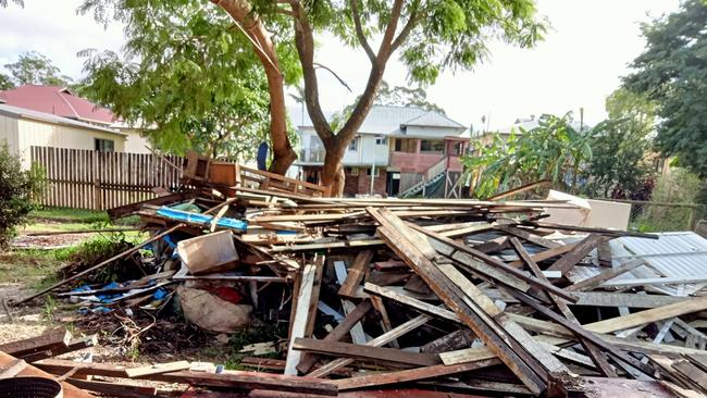 Piles of flood affected waste are still awaiting collection in parts of South Lismore. Picture submitted.