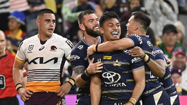 Jeremiah Nanai celebrates after scoring against the Broncos. Picture: Ian Hitchcock/Getty Images