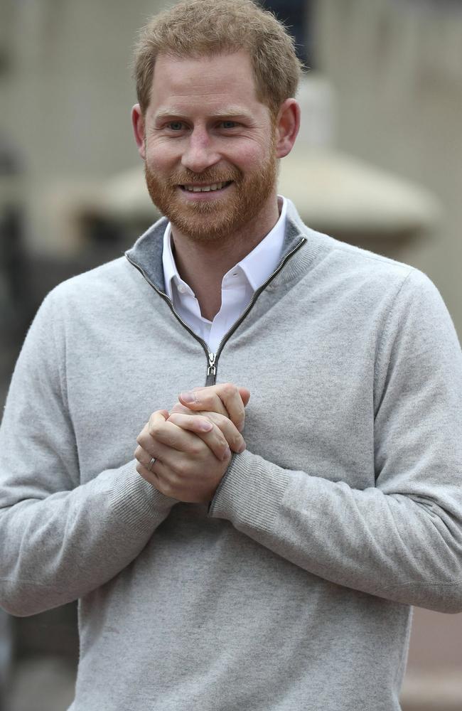 Prince Harry couldn’t contain his excitement as he spoke to the media. Picture: Steve Parsons/Pool via AP