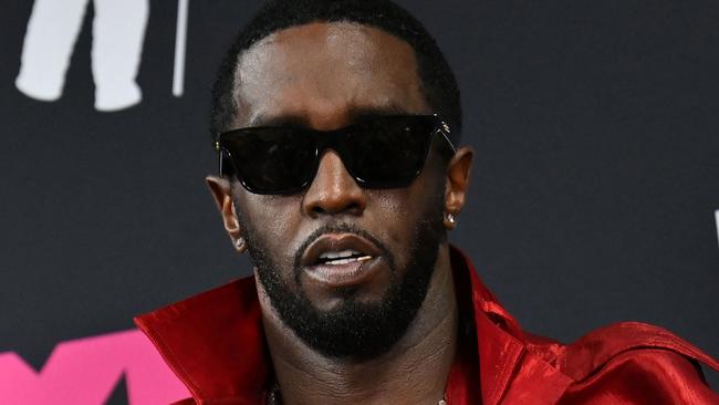 (FILES) (FILES) US producer-musician Sean "Diddy" Combs poses with the Global Icon award in the press room during the MTV Video Music Awards at the Prudential Center in Newark, New Jersey, on September 12, 2023. Music mogul Sean Combs is set to go on trial for racketeering and sex trafficking on May 5, 2025, a judge said in a court hearing October 10, 2024. The rapper known as "Diddy" will remain incarcerated, said federal judge Arun Subramanian, after he was indicted last month on three criminal counts that allege he sexually abused women and coerced them into drug-fueled sex parties using threats and violence. (Photo by ANGELA WEISS / AFP)