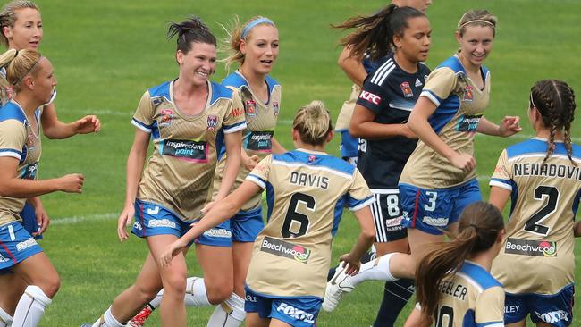 Arin Gilliland of the Jets is congratulated by her teammates after scoring the second goal against Victory.