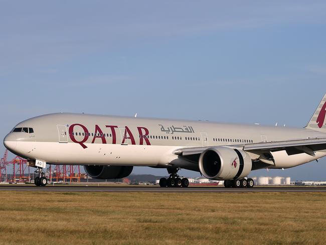 01/03/2016:A Qatar Airways  777-300 lands at Sydney Airport after its inaugural flight from Doha.The award-winning airline will fly a Boeing 777-300 daily between Sydney and Doha.Pic by James Croucher