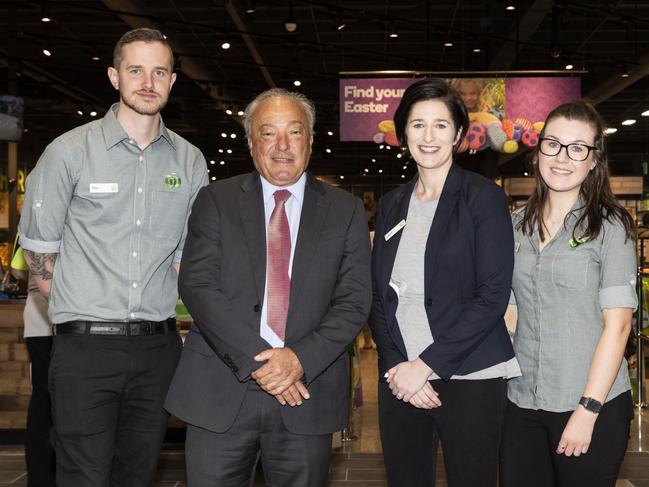 Macarthur federal MP Mike Freelander, store manager Laura Naughton and Woolworths staff at the grand opening today.