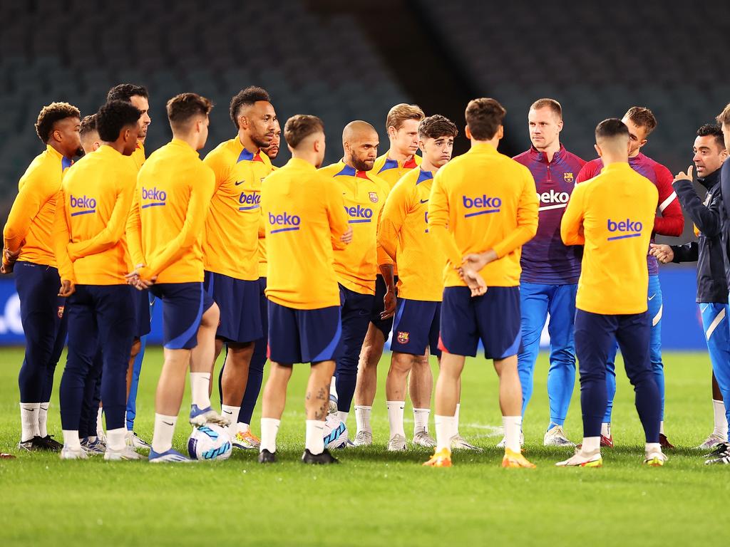 Barcelona coach Xavi Hernandez (right) speaks to his players at their Sydney training session. Picture: Mark Kolbe/Getty Images